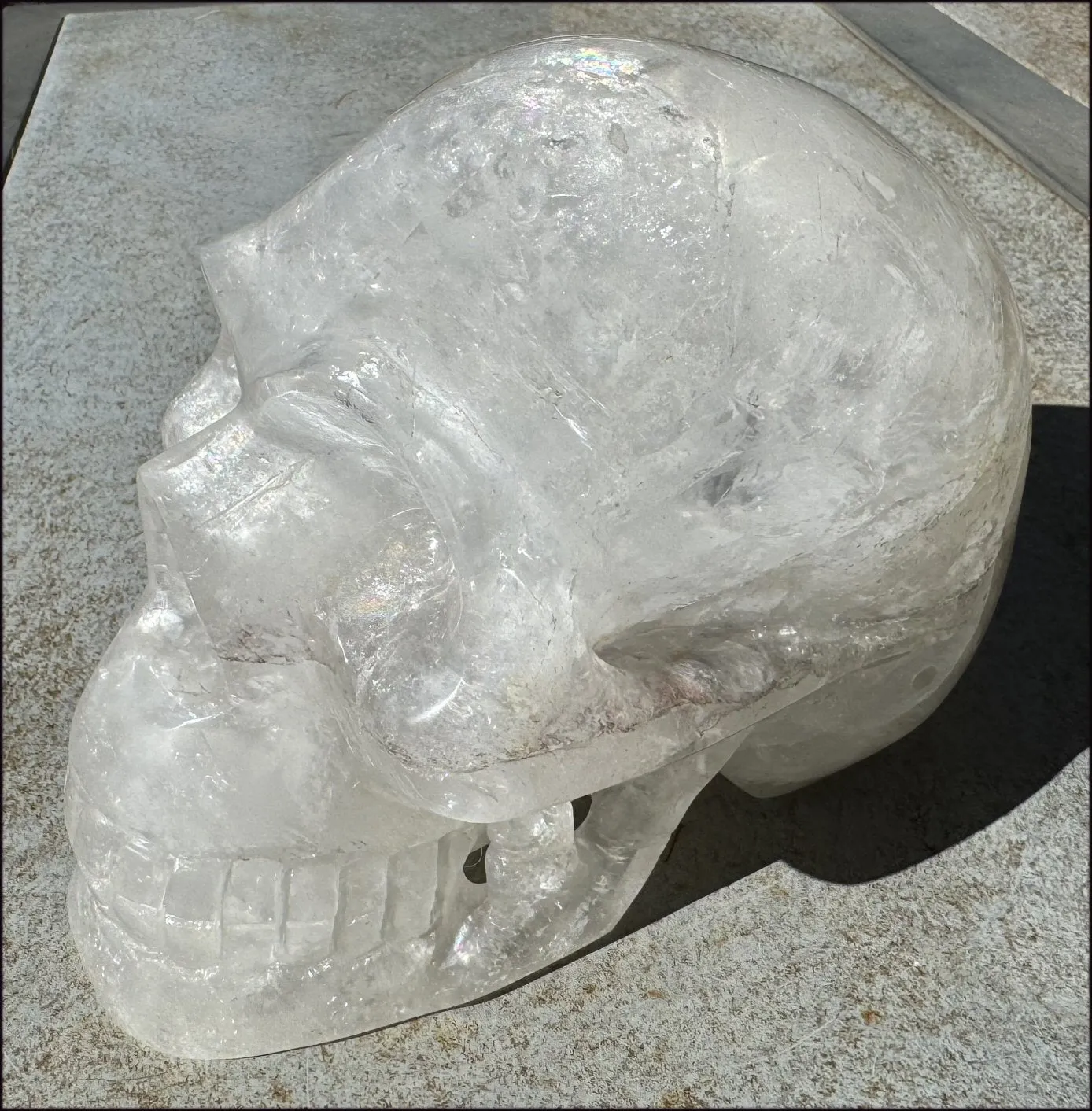 LifeSize Himalayan Quartz Crystal Skull with Multi-Colored Hematite, Shimmery Rainbows - 11lbs 