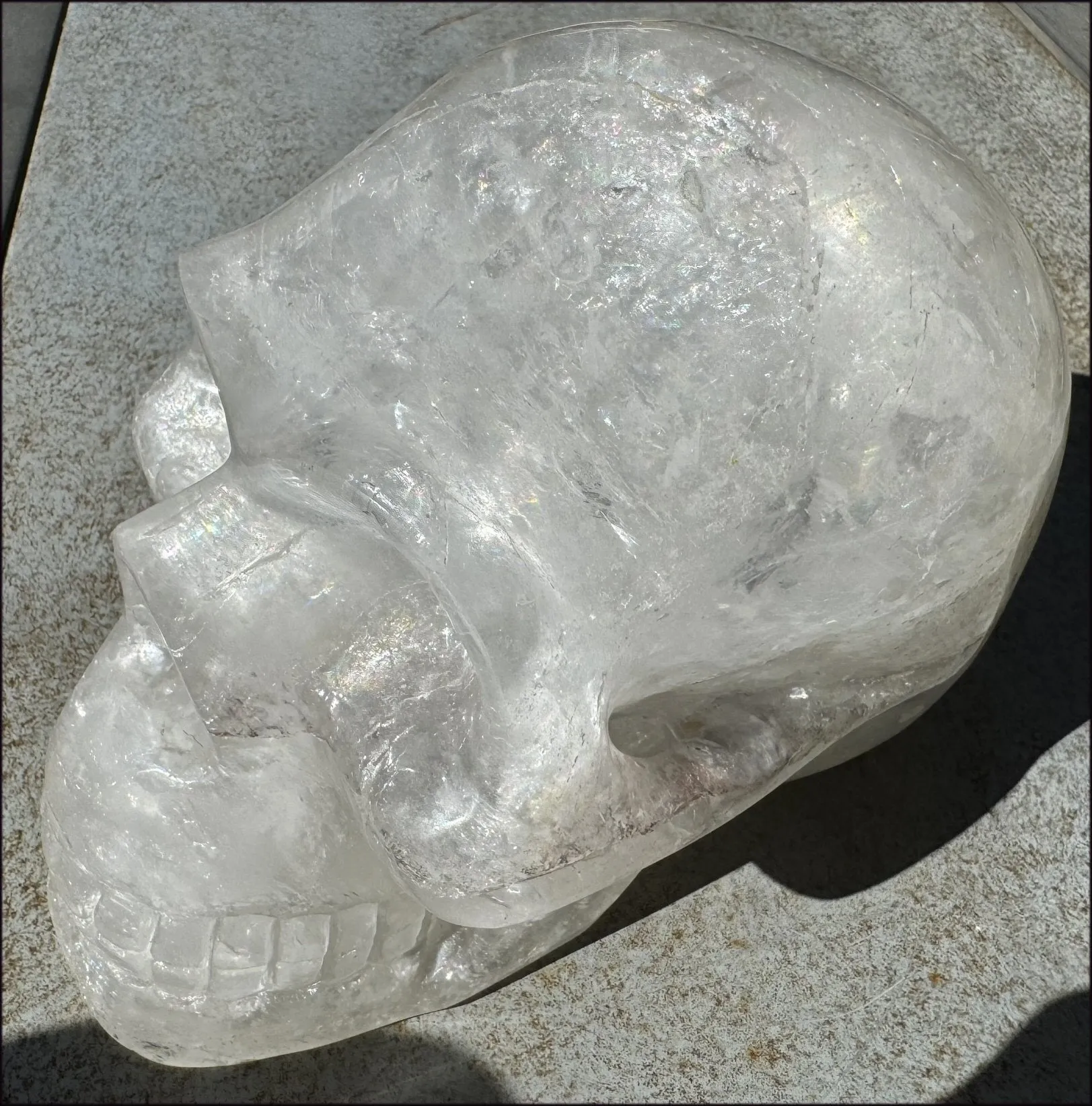 LifeSize Himalayan Quartz Crystal Skull with Multi-Colored Hematite, Shimmery Rainbows - 11lbs 