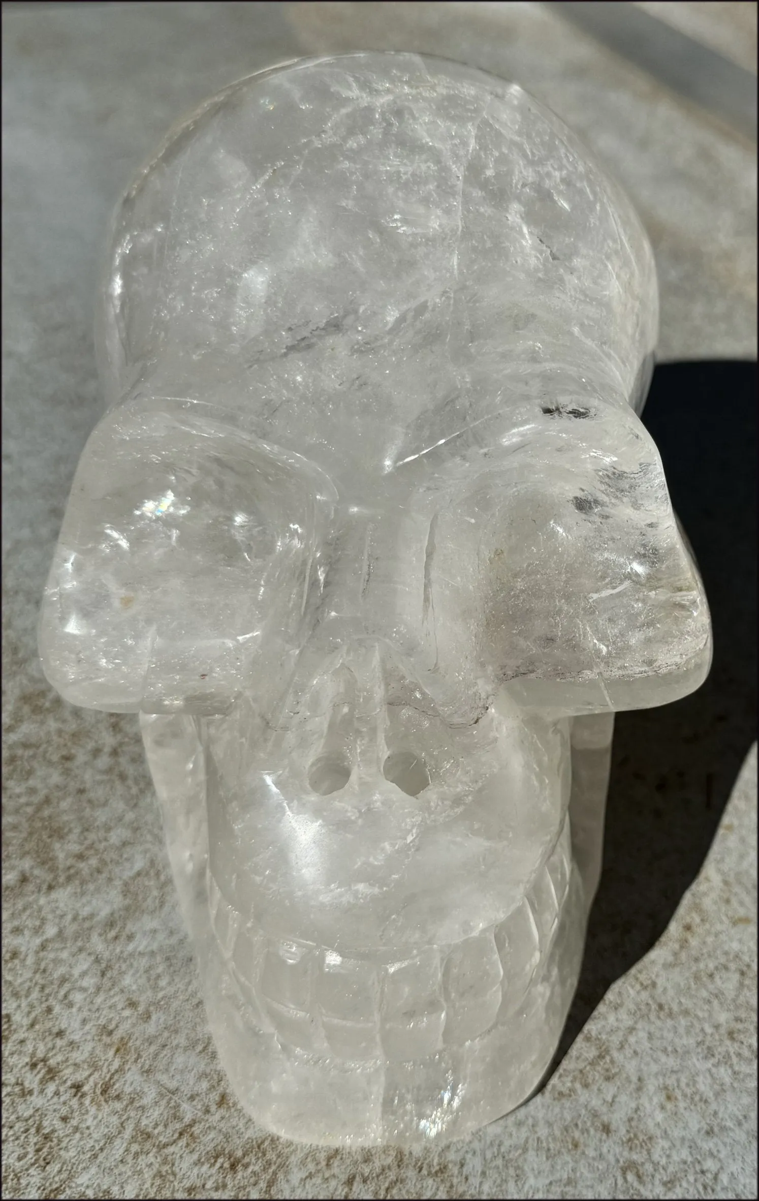 LifeSize Himalayan Quartz Crystal Skull with Multi-Colored Hematite, Shimmery Rainbows - 11lbs 