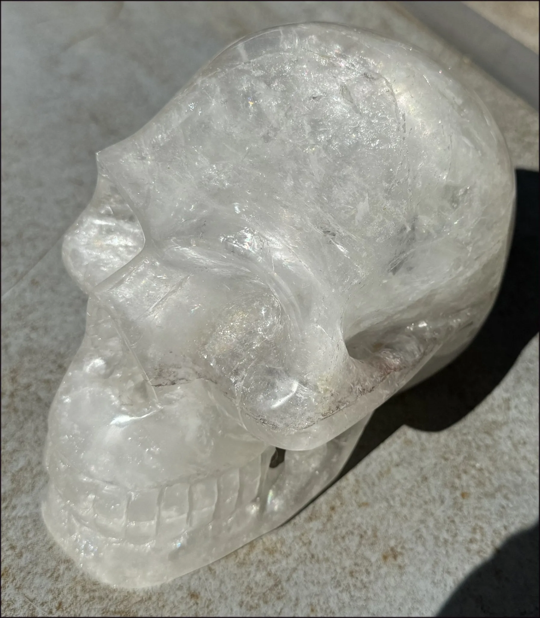 LifeSize Himalayan Quartz Crystal Skull with Multi-Colored Hematite, Shimmery Rainbows - 11lbs 