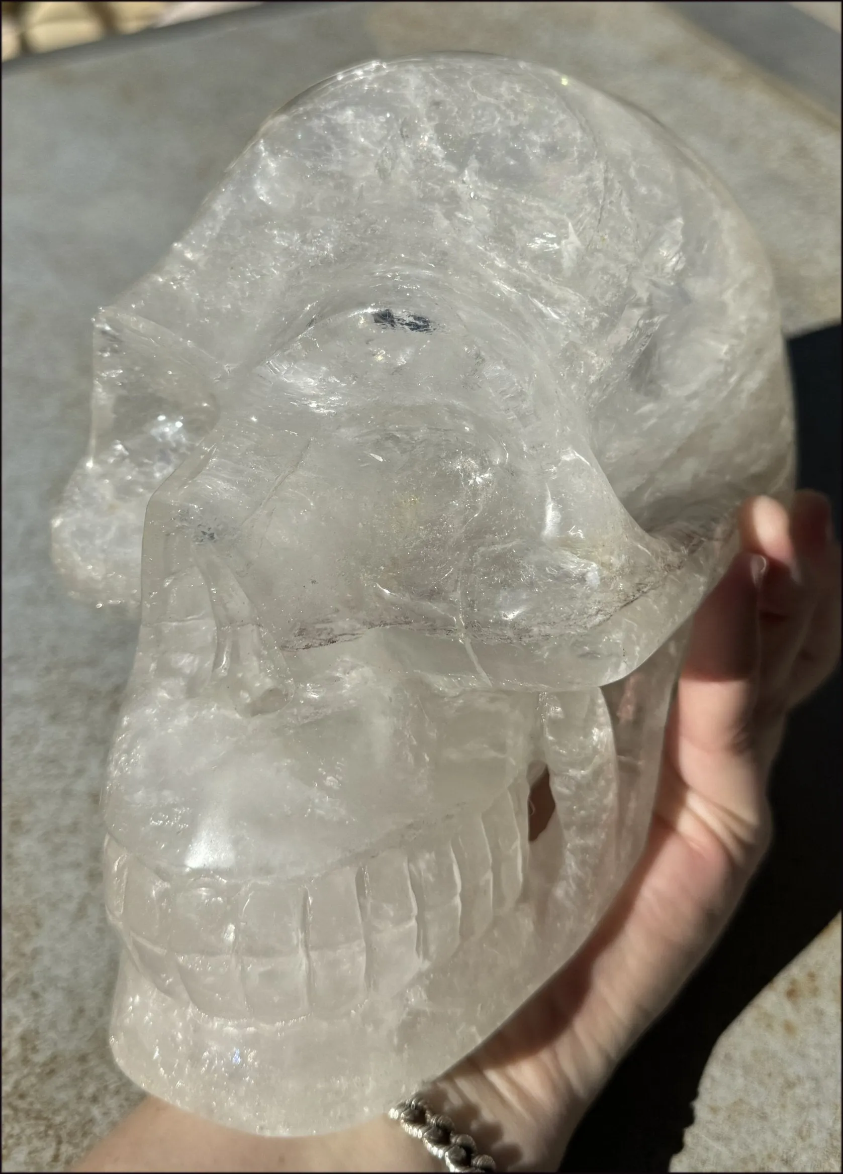 LifeSize Himalayan Quartz Crystal Skull with Multi-Colored Hematite, Shimmery Rainbows - 11lbs 