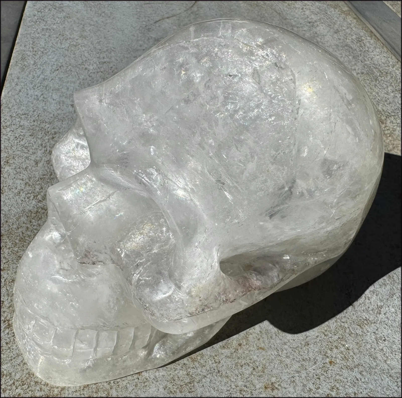 LifeSize Himalayan Quartz Crystal Skull with Multi-Colored Hematite, Shimmery Rainbows - 11lbs 