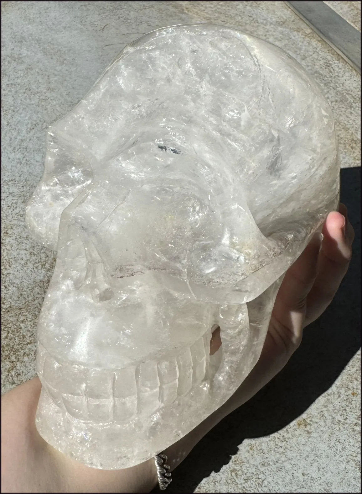 LifeSize Himalayan Quartz Crystal Skull with Multi-Colored Hematite, Shimmery Rainbows - 11lbs 